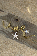 Bracelet chaine dorée avec breloques coquillages et étoile de mer
