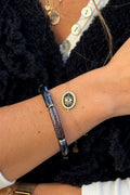 Bracelet petite maille dorée œil noir
