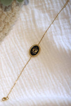 Bracelet petite maille dorée œil noir